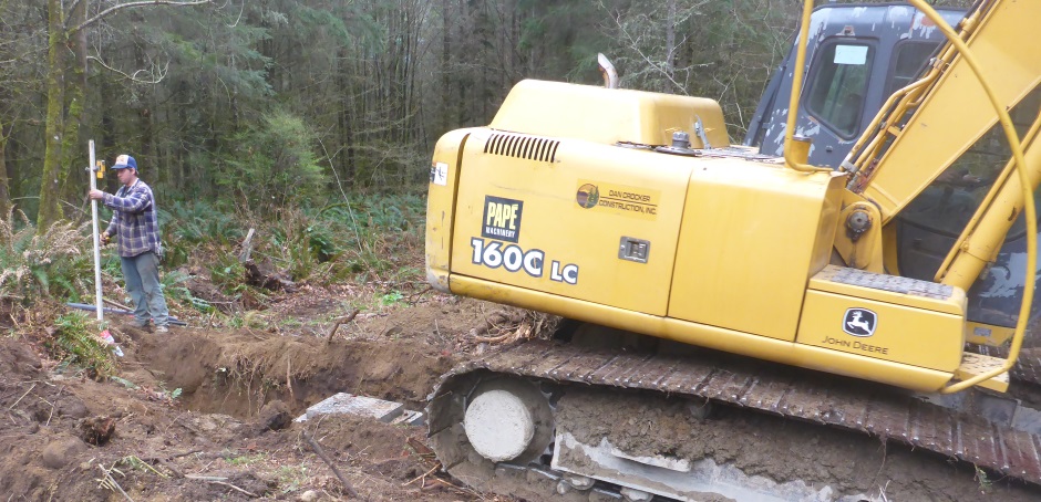 Excavator Dispersal Trench Catch Basin Installed